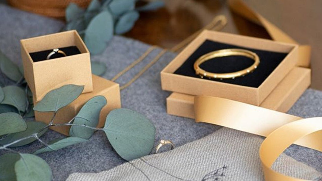 Luxury jewelry packaging UK featuring elegant gold boxes and accessories for jewelry presentation.