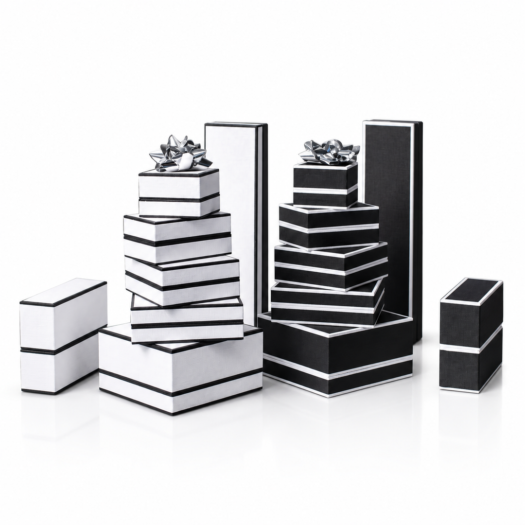 Everest Series collection of elegant black and white gift boxes stacked with bows, symbolizing ambition and achievement. Box for Britain.