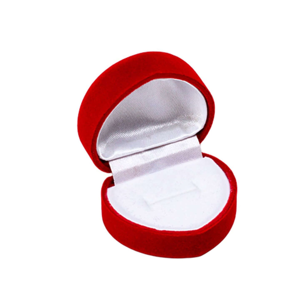 Elegant heart shaped red velvet ring box open, showcasing plush interior for a cherished ring.