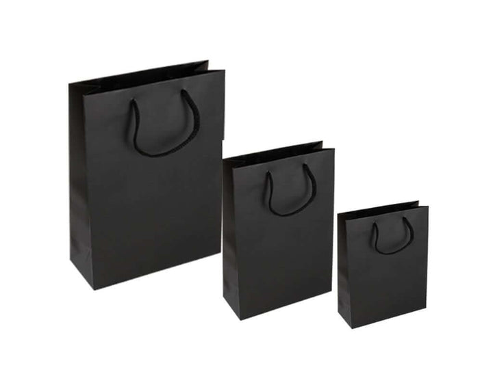 Large black paper gift bags in various sizes with sturdy rope handles.
